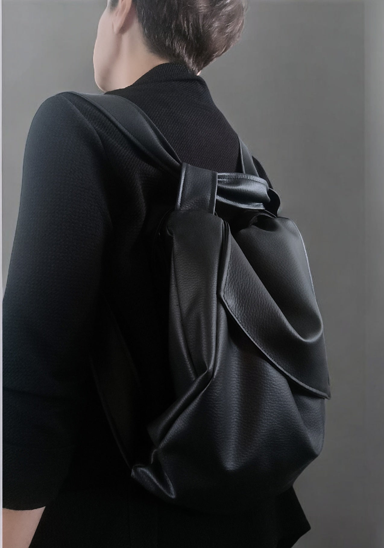Borsa in pelle sintetica convertibile in zainetto