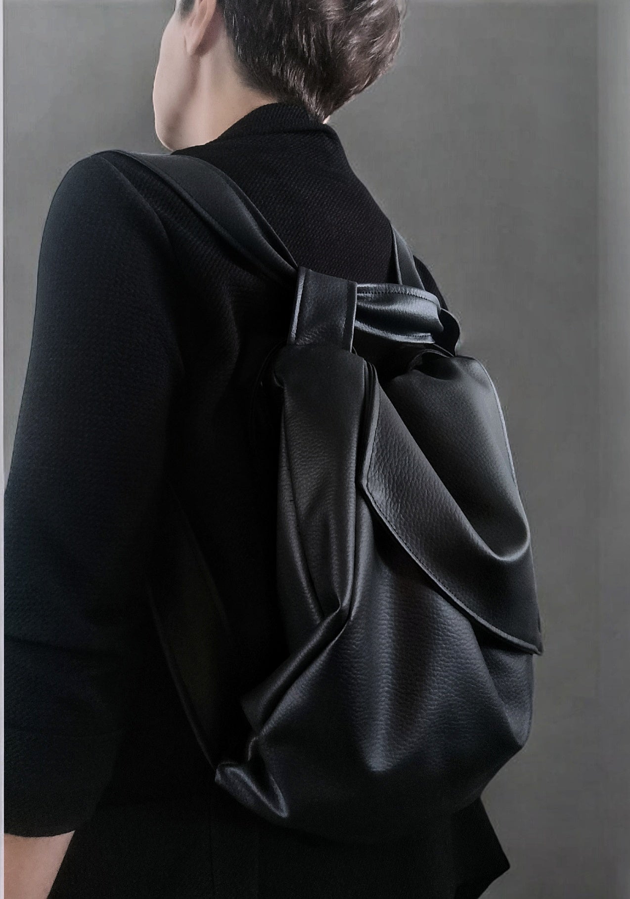 Borsa in pelle sintetica convertibile in zainetto